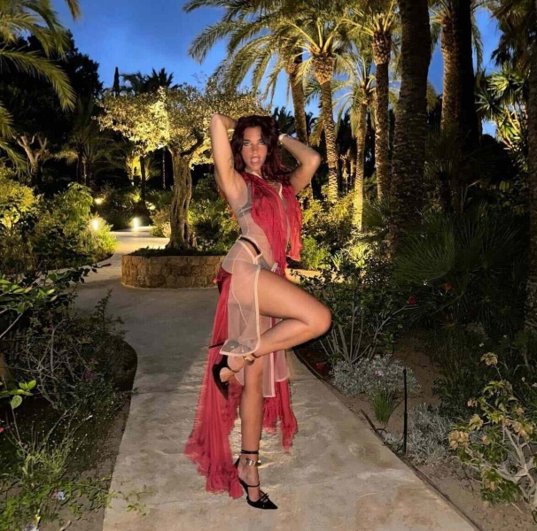 Dua Lipa wore a parade of tiny bikinis and a completely sheer dress paired with a black lace thong and matching bra as she rang in her 29th birthday in Ibiza.