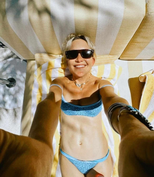 Kate Hudson shared an Instagram carousel on August 20 of her family vacation to Las Vegas, including a swimsuit-clad selfie that highlighted her washboard abs and a sultry photo in a thong bikini.