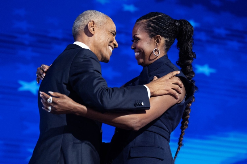 Michelle Obama stepped out at the Democratic National Convention on August 20 wearing an unconventional sleeveless suit from Monse, a waist-length bohemian braid, and divisive shoes. See the look.