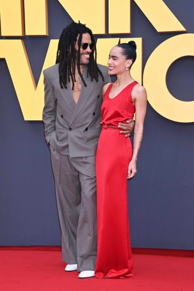 Zoë Kravitz wore a fiery, slinky Saint Laurent gown for the European premiere of her directorial debut, 'Blink Twice.' Her dad Lenny and fiancé Channing Tatum also wore Saint Laurent for the event. See their looks, here.