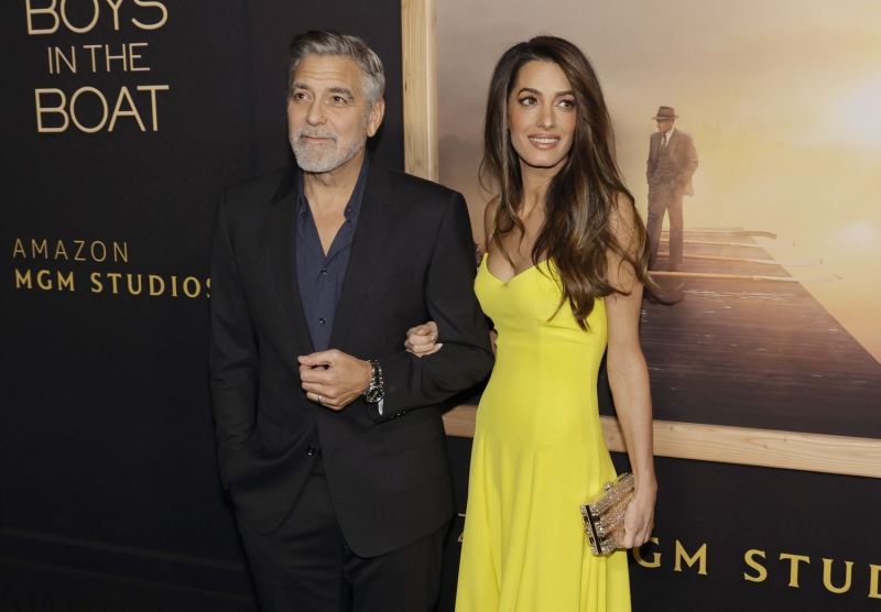 Amal Clooney stepped out in another stylish and colorful outfit at the Venice Film Festival, wearing a bright tangerine jumpsuit with George Clooney on Tuesday, Sept. 3.