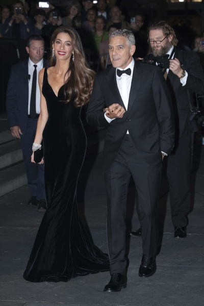 Amal Clooney wore a plunging black velvet Versace gown to the Clooney Foundation for Justice's Albie Awards on September 26, 2024. See the look, here.