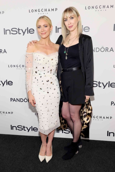 Brittany Snow attended 'InStyle''s 30th birthday party in a white tulle midi dress with a corseted midsection and rhinestone embellishments. See her look, here.