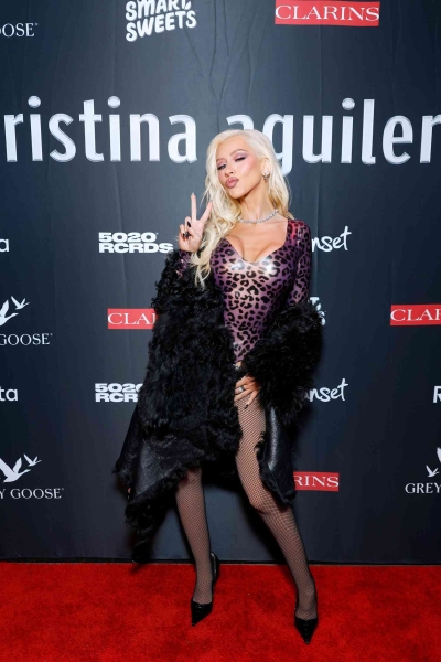 Christina Aguilera celebrated the 25th anniversary of her debut album with a Spotify Live album and a party in Los Angeles where she arrived wearing a leopard-print latex bodysuit. See her outfit, here.