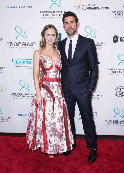 Emily Blunt wore a two piece crop top gown by Erdem that featured a plunging deep V neckline at the top and a large red floral print. See her outfit, here.