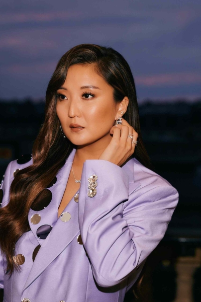 Emily in Paris actress Ashley Park always knows how to make a statement with not just her fashions but her jewelry. She joined mega brand Pandora at an intimate dinner to kickoff Pais Fashion Week. See how she got ready for the dinner here and all of her behind-the-scenes photos.