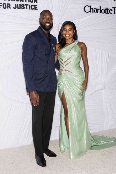 Gabrielle Union attended the third annual Albie Awards in a mint green Versace gown with ab-baring cutouts and a thigh-high slit. See her full look, here.