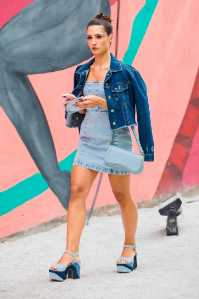 If you're wondering how to style a denim dress, you're in luck. From outerwear to complementary accessories, check out 17 denim dress outfits, here.