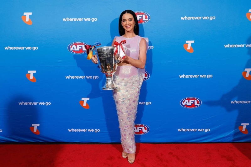 Katy Perry made an appearance ahead of her AFL Grand Final performance this weekend in Australia wearing a long skirt and crop top with shimmering wings. See the full look, here.