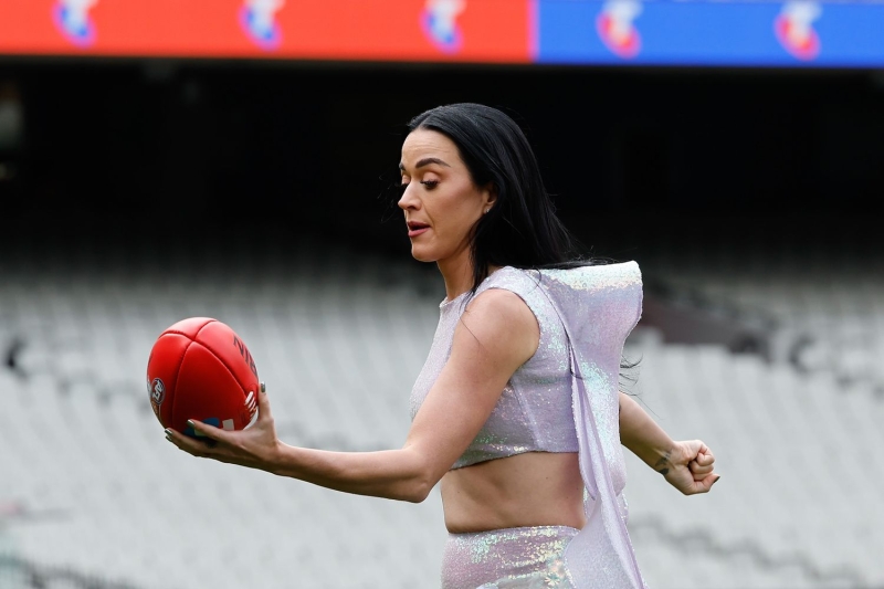 Katy Perry made an appearance ahead of her AFL Grand Final performance this weekend in Australia wearing a long skirt and crop top with shimmering wings. See the full look, here.