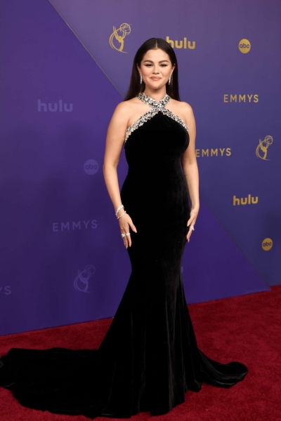 Selena Gomez arrived to the 2024 Emmys wearing a black velvet gown with a crystal-encrusted neckline. See her full look, here.