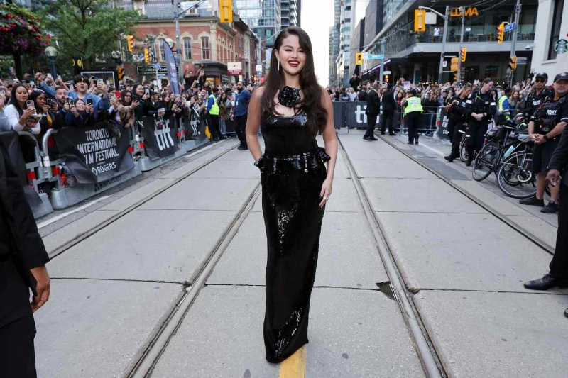 Selena Gomez wore a Rodarte gown to the 2024 Toronto International Film Festival. The dress featured both a flower corsage detail and a peplum. See the look, here.