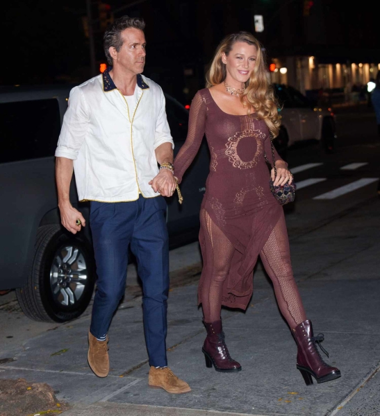 Blake Lively wore a sheer mesh maroon dress with fishnet details as she stepped out for a double date with Taylor Swift, Travis Kelce, and Ryan Reynolds on Friday, October 11.