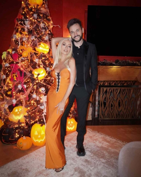 Christina Aguilera wore a sexy pumpkin-spice slip dress on Instagram. See the look and its spooky Halloween-inspired detail, here.