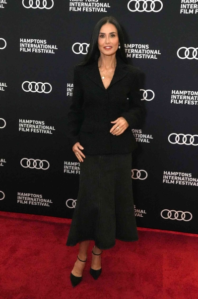 Demi Moore made a convincing case for red carpet denim as she stepped out in a surprisingly elegant gray jean skirt and her mini chihuahua Pilaf at the Hamptons International Film Festival on October 13.