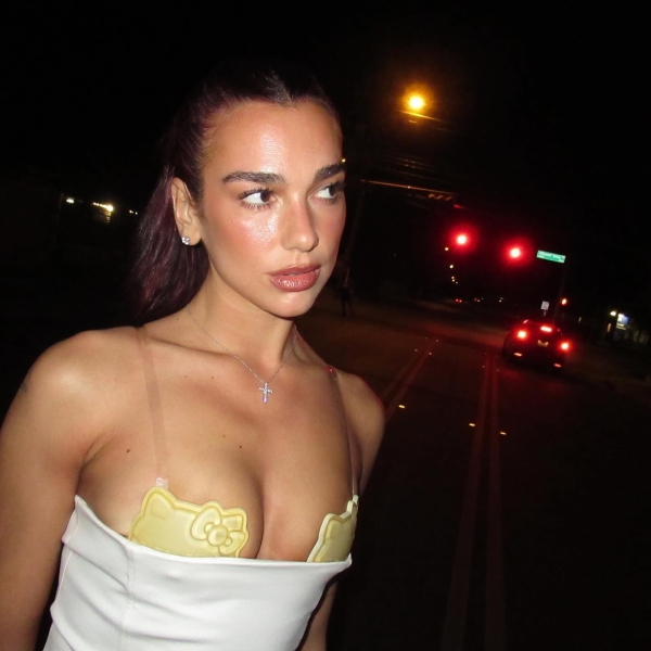 Dua Lipa paired a strapless white minidress with a gold bra with Hello Kitty's face on each cup peeking out from underneath. See photos, here.