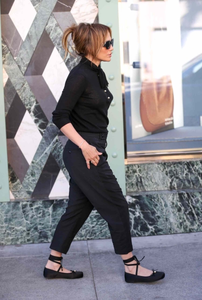 Jennifer Lopez was spotted in Los Angeles wearing a very unusual shoe trend: black lace-up ballet flats.