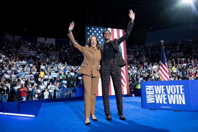 Kamala Harris wore a caramel pantsuit with a street style detail while campaigning alongside Michelle Obama in Michigan on Saturday, October 26.