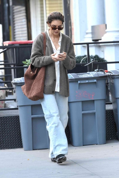 Katie Holmes wore a cozy knit cardigan with a white button-up shirt and blue jeans for fall. See the look here.