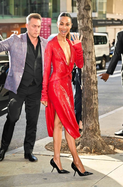 Look of the Day for October 2, 2024 features Zoe Saldaña in a red sequin dress with a plunging neckline and thigh-high side slits, and black heels with the coolest architectural heel. Shop red dresses and heels from Favorite Daughter, Jeffrey Campbell, and more.