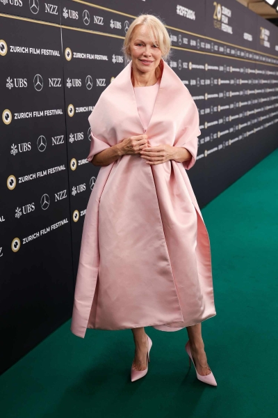 Pamela Anderson attended a Q&A session at the 20th annual Zurich Film Festival wearing a fuzzy white pantsuit that reminded us of her memorable VMAs hat. See her full outfit, here.