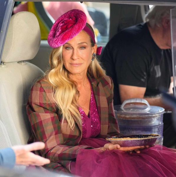 Sarah Jessica Parker was seen filming 'And Just Like That...' wearing a pink hat. See her full hot pink look, here.