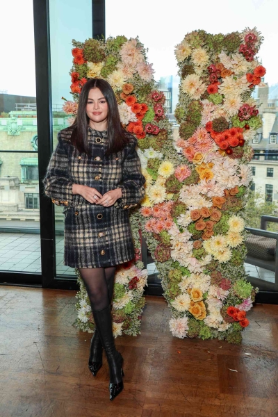 Selena Gomez attended a brunch during London Film Festival and wore a classic tweed skirt set that featured an unusual set of funky mismatched buttons.