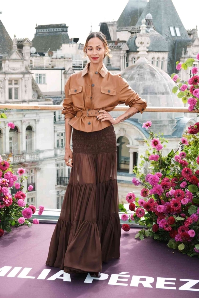 Zoe Saldaña wore a full Saint Laurent look to the 'Emilia Perez' photo call in London that included a fall-ready palette and a skirt with a surprising sheer detail. See her look, here.