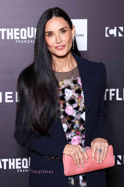 Demi Moore appeared at the French premiere of 'The Substance' wearing a floral look that broke seasonal fashion rules and veered away from her signature menswear-inspired style.