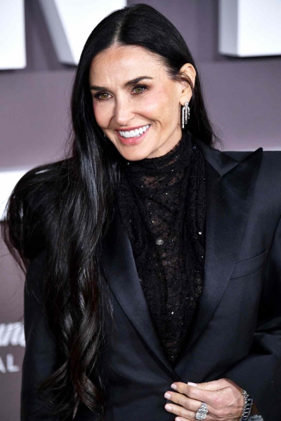 Demi Moore wore a shimmering McQueen gown to the premiere of Paramount+'s 'Landman.' See her full oil-slick inspired look, here.