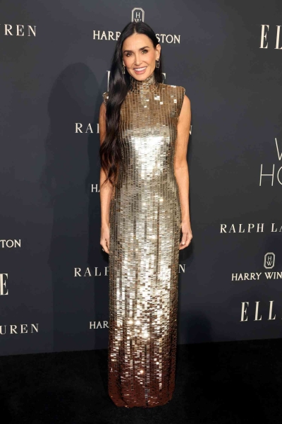 Demi Moore wore a silver sequined gown by Ralph Lauren to the 2024 Elle Women of the Year event. See the outfit here.