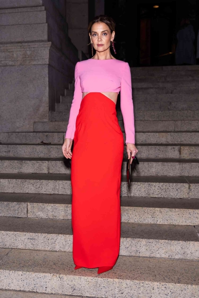 Katie Holmes brought dopamine dressing to the 2024 CFDA Awards, posing in a skin-baring color-block gown with large side cutouts and a plunging back on the red carpet on October 28.