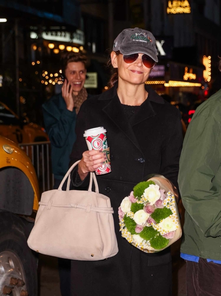 Katie Holmes showed off an effortlessly chic look with a nod to Gen Z as she paired an Olsen Twin-worthy oversized coat with Nike Air Force 1 sneakers on November 25. Read how she's embracing zoomer fashion trends here.