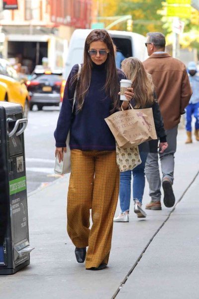 Katie Holmes stepped out in a boxy blazer and baggy, Gen-Z approved jeans. See her look, here.