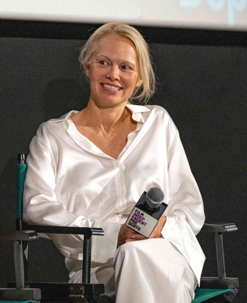 Pamela Anderson attended a screening of her upcoming film, 'The Last Showgirl' in her winter whites without makeup. See her look, here.