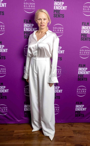 Pamela Anderson embraced minimalist red carpet style and beauty by going makeup-free with her go-to winter whites at a screening for 'The Last Showgirl' on November 12.