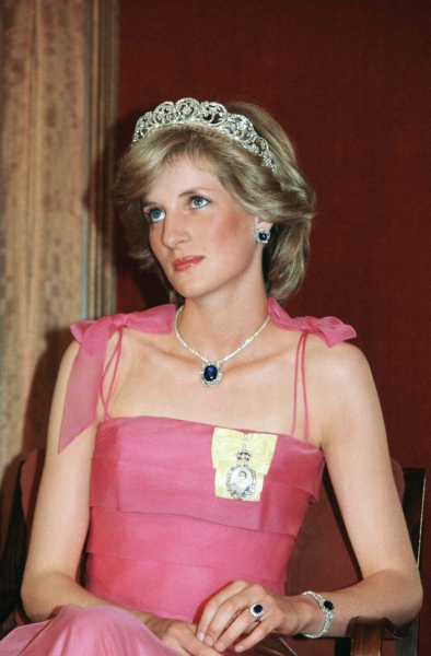 Princess Diana's famous cheetah-print swimsuit and matching sarong set was actually a coverup for a "microscopic" red bikini, according to former royal correspondent Jane Moore. See more, here.