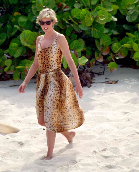 Princess Diana's famous cheetah-print swimsuit and matching sarong set was actually a coverup for a "microscopic" red bikini, according to former royal correspondent Jane Moore. See more, here.