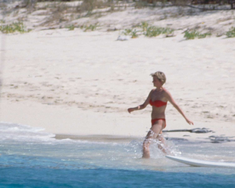 Princess Diana's famous cheetah-print swimsuit and matching sarong set was actually a coverup for a "microscopic" red bikini, according to former royal correspondent Jane Moore. See more, here.