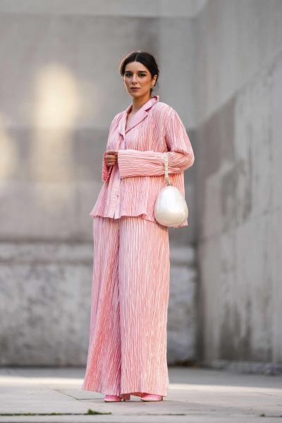 Satin pajama sets have become a street style staple and we've got fresh ways to wear them. Here's how to wear a satin pajama set outside of the house for date night, brunch, and everything in between.