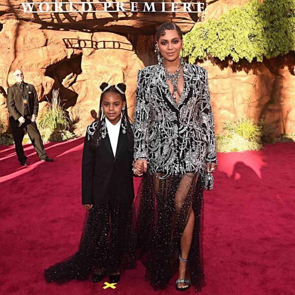 Beyoncé and her lookalike daughter Blue Ivy wore coordinating golden gowns to the 'Mufasa: The Lion King' Los Angeles premiere on Monday, December 9. See their matching mother-daughter dresses, here.