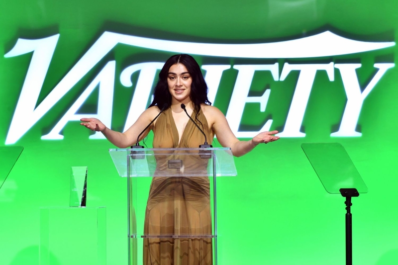 Charli XCX attended Variety's Hitmakers Brunch in Los Angeles wearing a sheer, nipple-baring dress in a wintery shade of Brat green. See her full look, here.