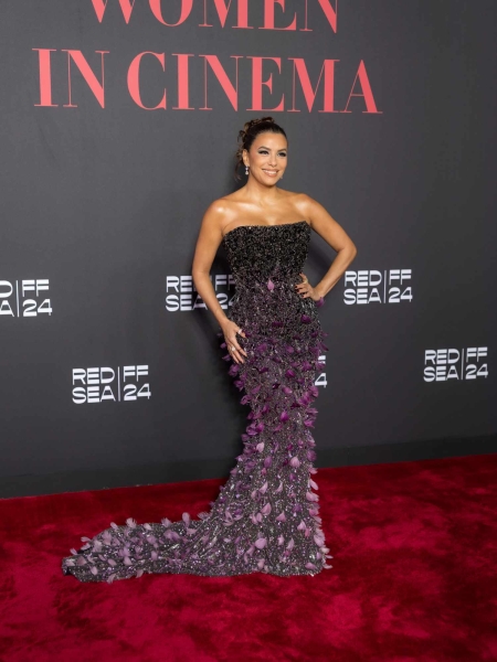 Eva Longoria stepped out in a retro flight attendant-inspired dress paired with divisive heels as she stepped out at a Red Sea Film Festival photocall on Friday, December 6. See the look, here.