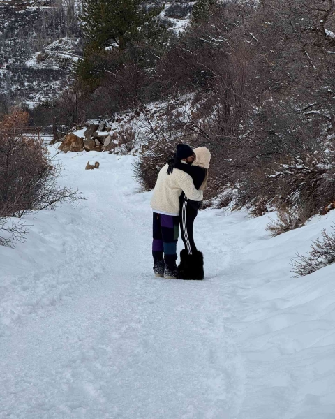 Heidi Klum wore a sheer red lace bra and matching thong underwear to play out in the snow during her winter vacation in Aspen, Colorado.