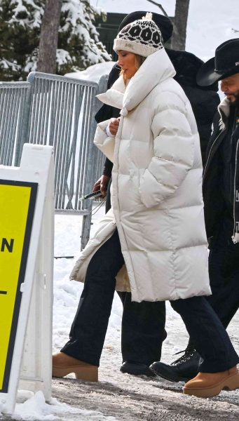 Jennifer Lopez hit the slopes with her friends in Aspen, Colorado, wearing a rule-breaking white puffer coat with a white sweater and Ugg boots. See her full ski-chic look, here.