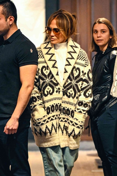 Jennifer Lopez sported a chalet-ready sweater and Uggs look during a Christmas skiing holiday in Aspen.