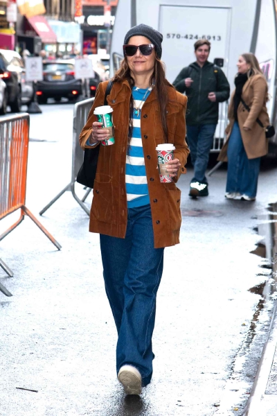 Katie Holmes wore a corduroy jacket and baggy y2k jeans for going to pick up coffees before work. See the outfit here.