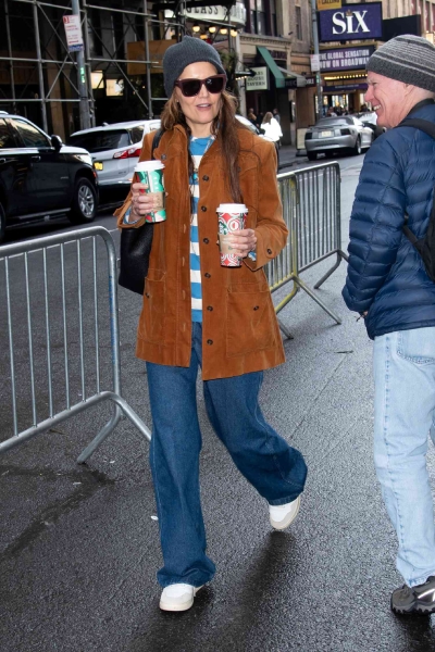 Katie Holmes wore a corduroy jacket and baggy y2k jeans for going to pick up coffees before work. See the outfit here.