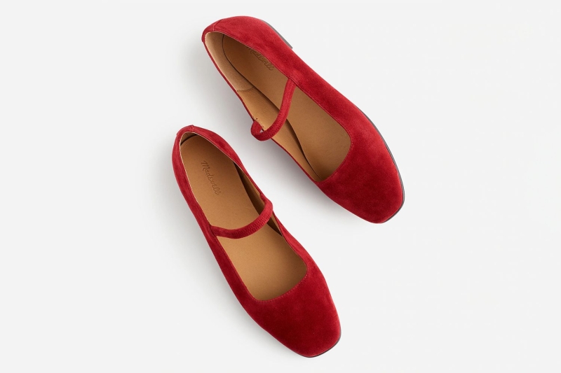 Katie Holmes wore red velvet flats while out and about in New York City, proving that the classic shoe style isn’t just practical, but perfect accessory for the holiday season. Shop seven lookalikes of her festive flats at Amazon, Nordstrom, Madewell, and more from $19.