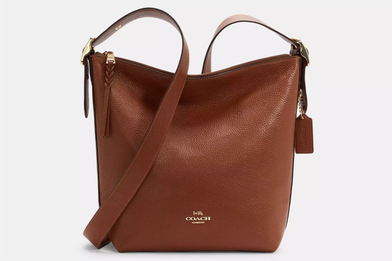 Katie Holmes wore winter’s no. 1 accessory: a practical bucket bag that is spacious, structured, and sleek for everyday use. I found eight lookalikes of her chocolate brown tote at Amazon, Nordstrom, Coach, and more, starting at $33.